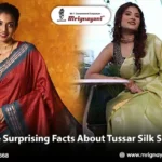 Two Indian women wearing elegant red and light green Tussar silk sarees, showcasing traditional silk craftsmanship and ethnic fashion from Mrignayani Kolkata.