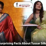 Two Indian women wearing elegant red and light green Tussar silk sarees, showcasing traditional silk craftsmanship and ethnic fashion from Mrignayani Kolkata.