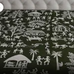 Hand block printing inspired fabric with intricate tribal illustrations and traditional village motifs, highlighting India's rich textile design heritage.