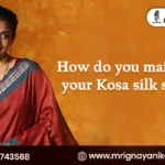 Beautiful woman in a red Kosa silk saree with a blue border, highlighting silk saree maintenance and care tips by Mrignayani Kolkata.