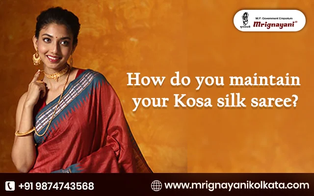 Beautiful woman in a red Kosa silk saree with a blue border, highlighting silk saree maintenance and care tips by Mrignayani Kolkata.